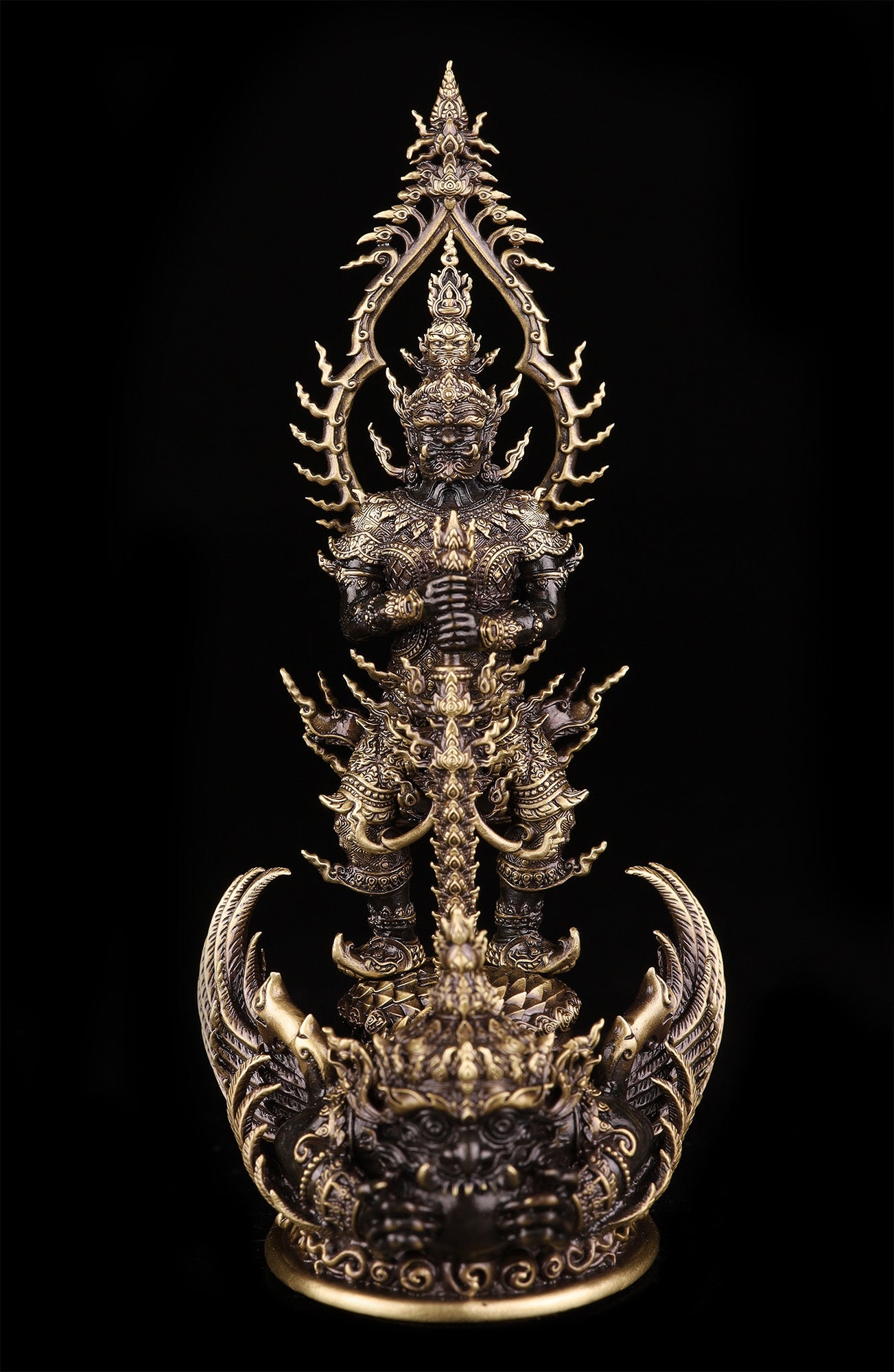 Thao Wessuwan statue for wealth and protection. Ornate brass Thai guardian amulet pendant with intricate details
