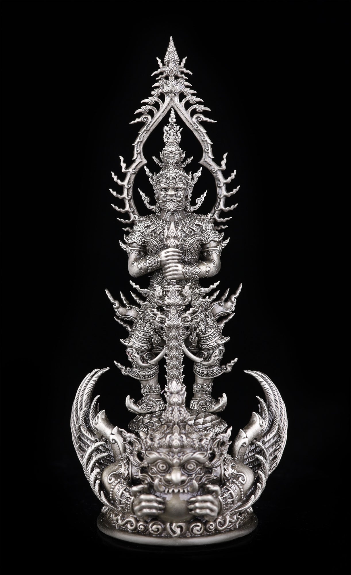 Thai Blessing Co silver Thao Wessuwan statue for wealth and protection. Ornate guardian deity holding sword on demon pedestal