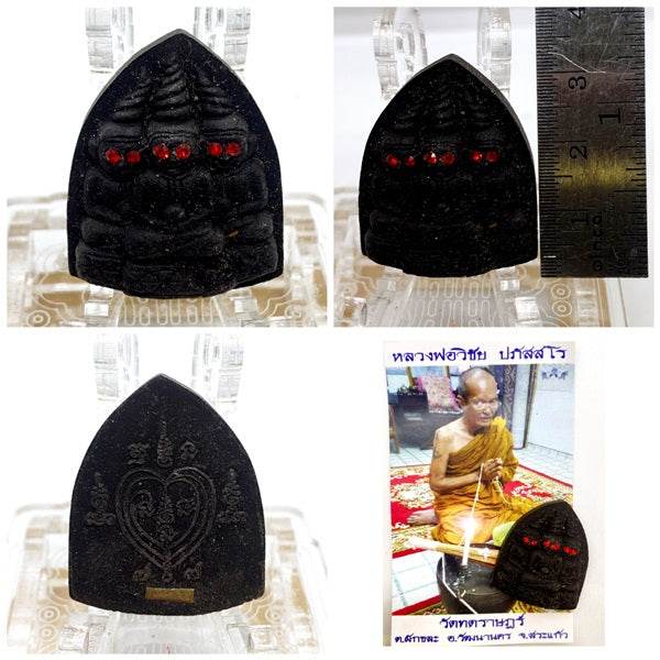 Thai blessed love and money talisman featuring intricate carvings and red gemstones for positive energy