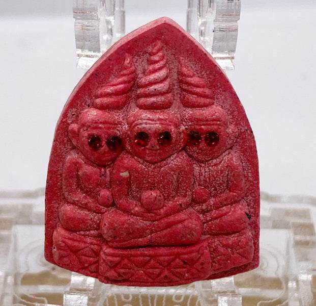 Thai blessed love and money talisman featuring three figures sculpted in red stone for prosperity and protection