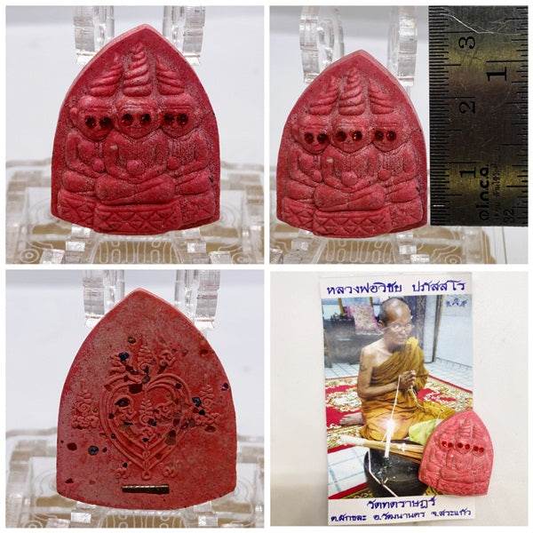 Thai blessed love and money talisman in red with intricate carvings and a monk's image