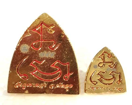 Thai blessed talisman good luck in gold with intricate designs for protection and fortune