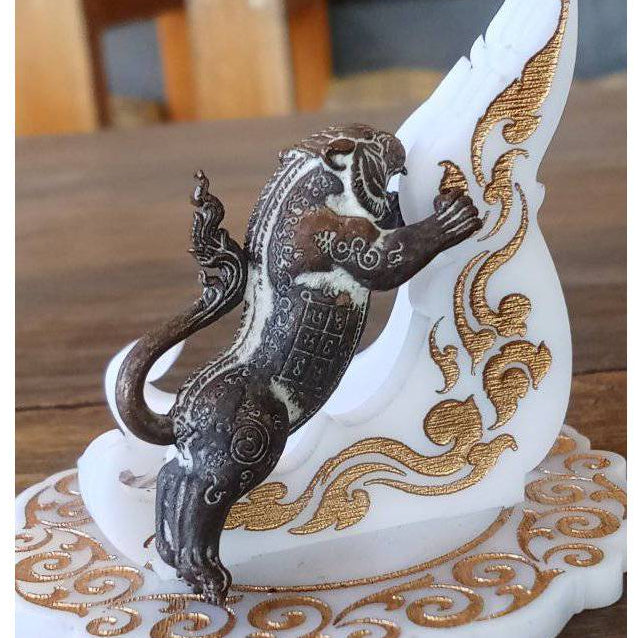 Thai Blessing Co Tiger Pern amulet for protection bronze tiger climbing a white carved stand with gold accents