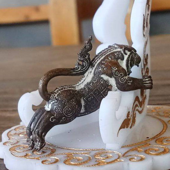 Tiger Pern amulet for protection antique bronze leaping tiger with engraved Thai yantra details on white base