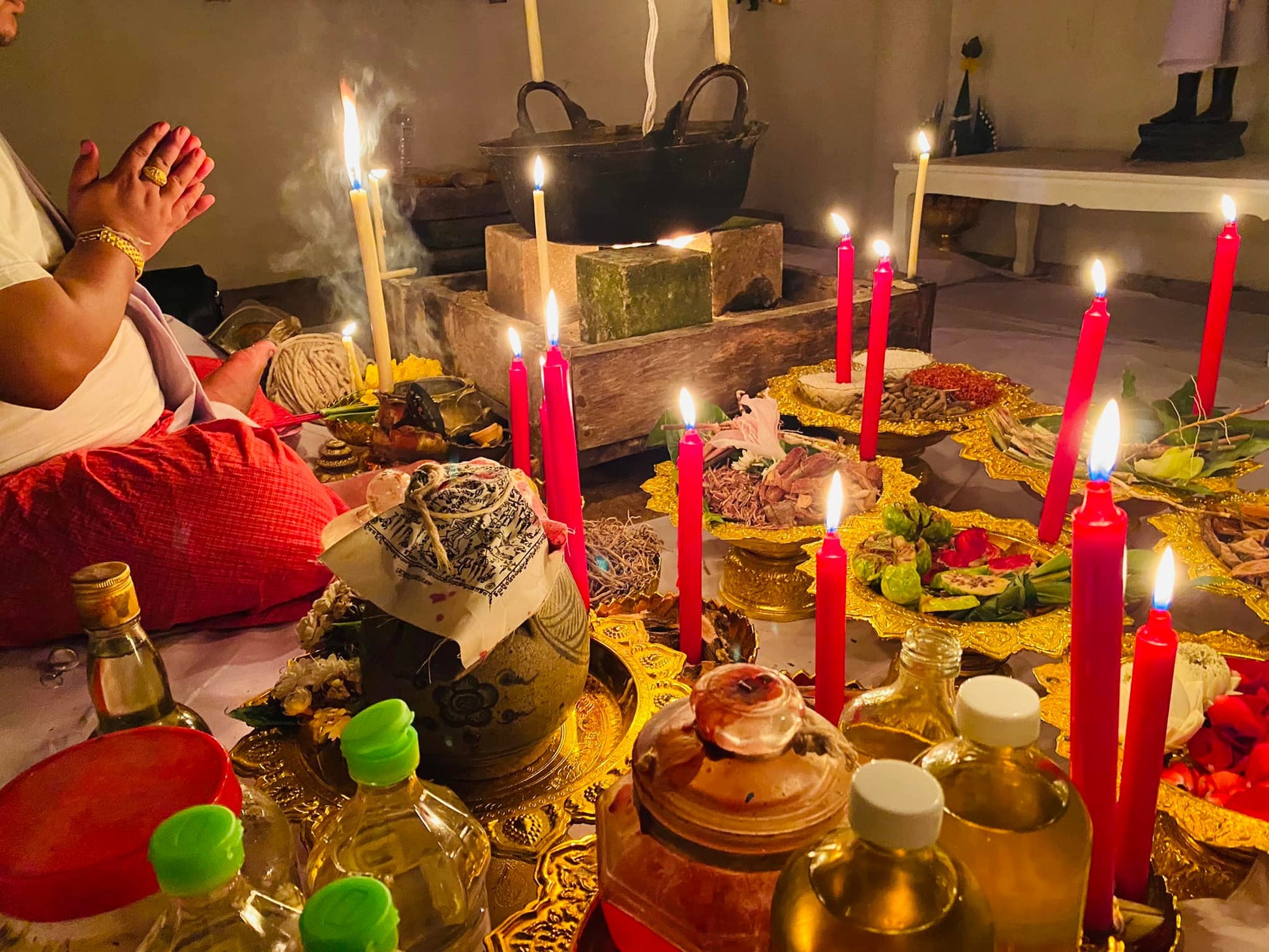 Ceremonial setting showcasing a fortune boosting Thai talisman surrounded by candles and offerings