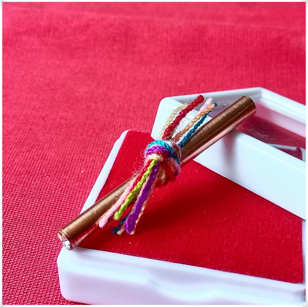 Fortune boosting Thai talisman tied with colorful threads for positive energy and luck