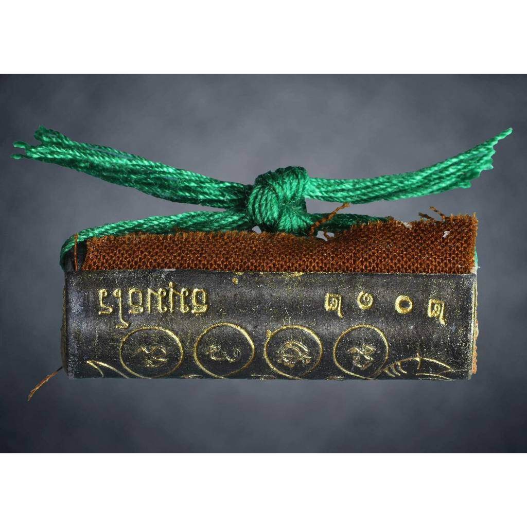 Thai boar talisman for luck with gold inscriptions and green cord from Thai Blessing Co