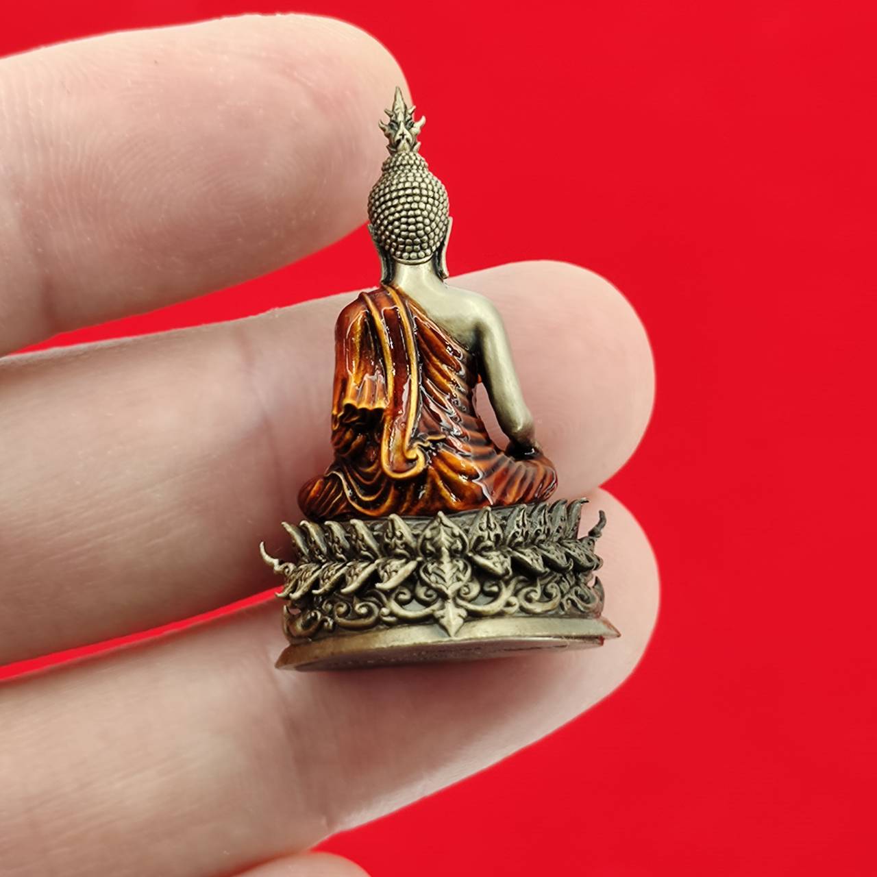 Thai Buddha amulet blessed by Luang Por Weera, intricately detailed with traditional colors and design