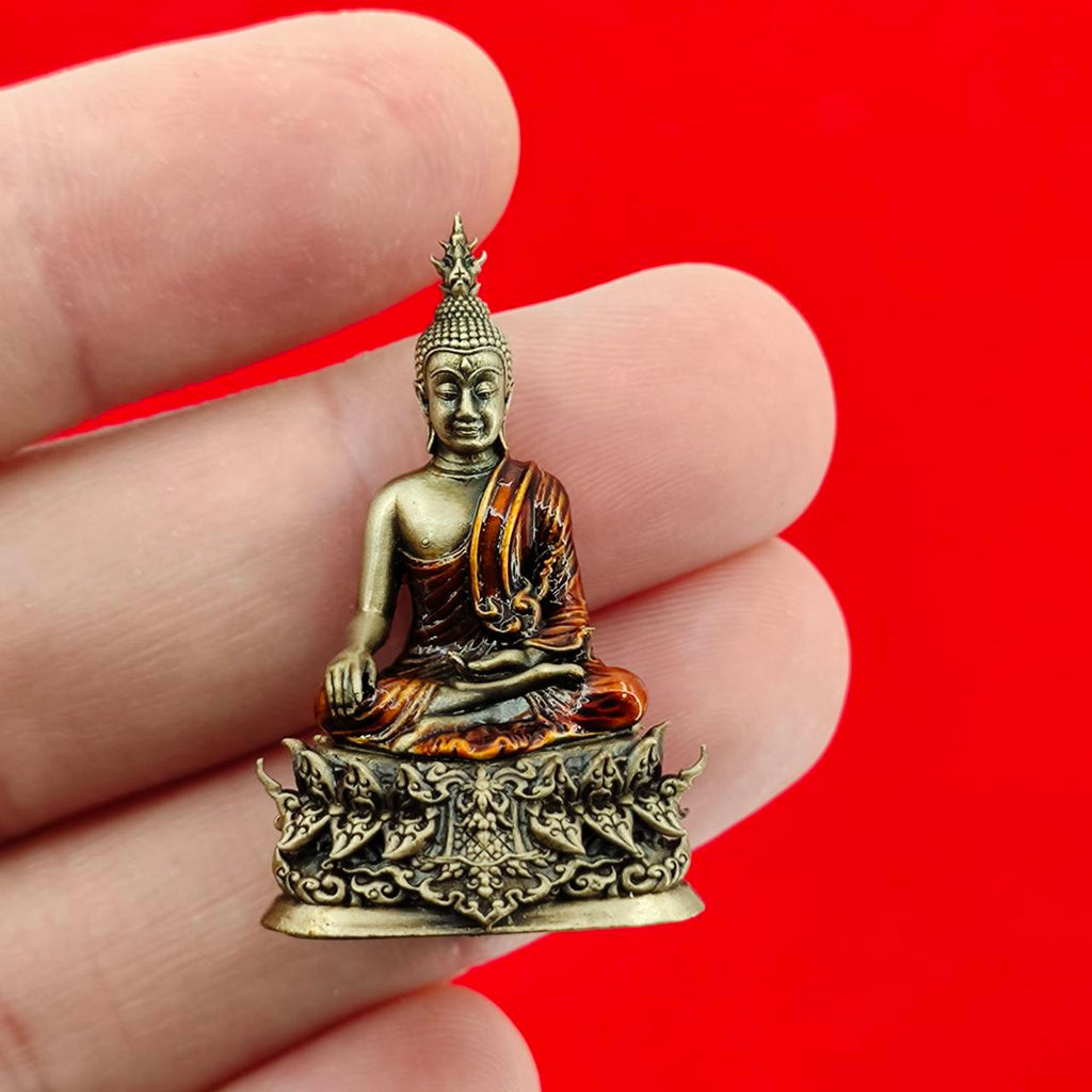 Thai Buddha amulet blessed by Luang Por Weera, hand-held statue with detailed craftsmanship and rich colors