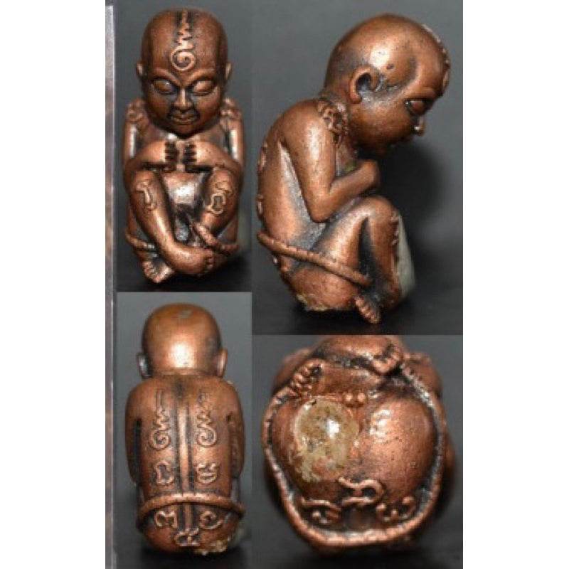 Thai child spirit for good luck statue with intricate details and a seated pose for auspicious energy