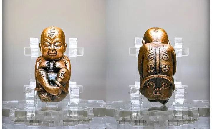 Thai child spirit for good luck statue in bronze with intricate details and a serene expression
