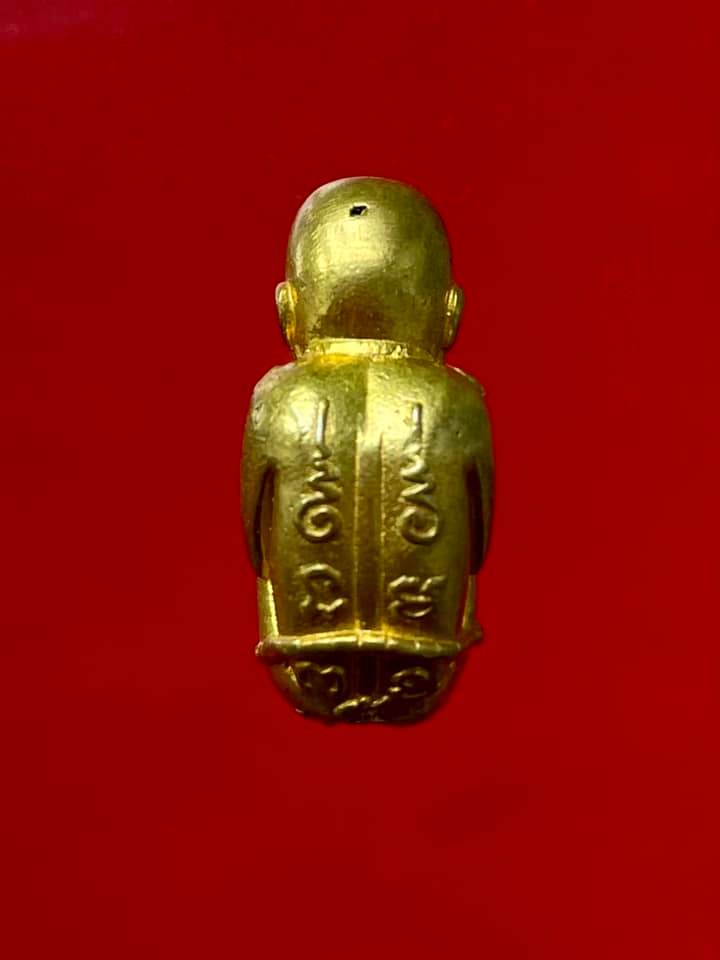 Thai child spirit for good luck statue in gold, symbolizing prosperity and protection