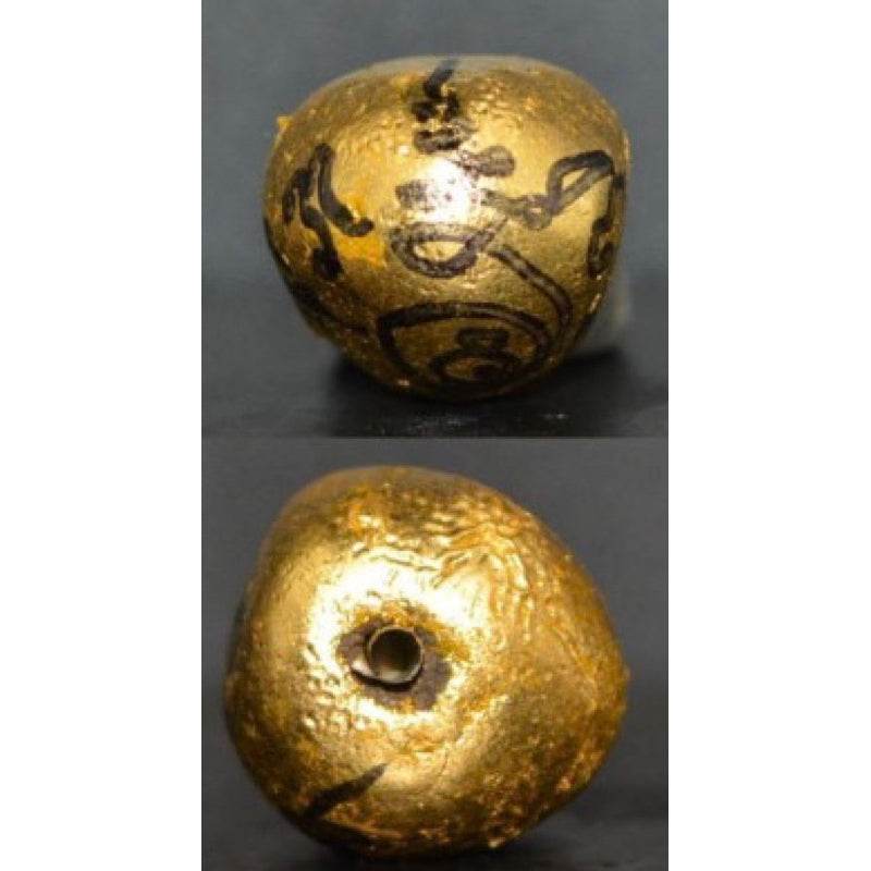 Golden Thai child spirit for good luck amulet with traditional symbols for fortune and protection