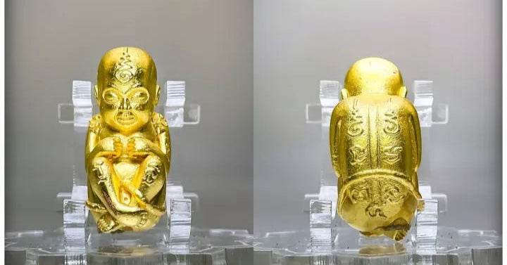 Thai child spirit for good luck statue in gold, symbolizing fortune and protection for the home