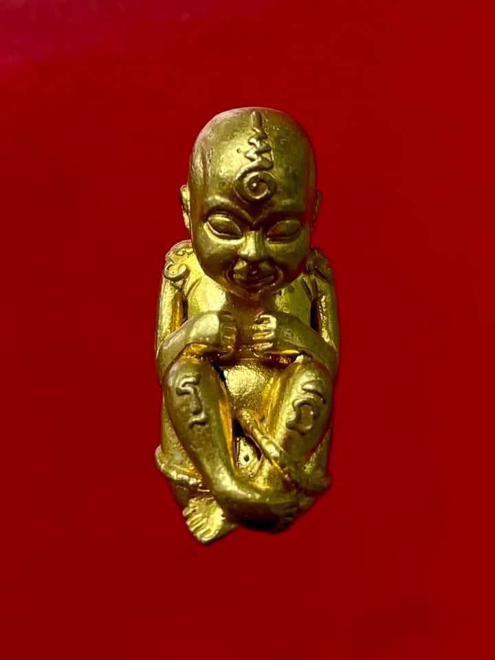 Thai child spirit for good luck figurine in gold, symbolizing prosperity and protection in homes