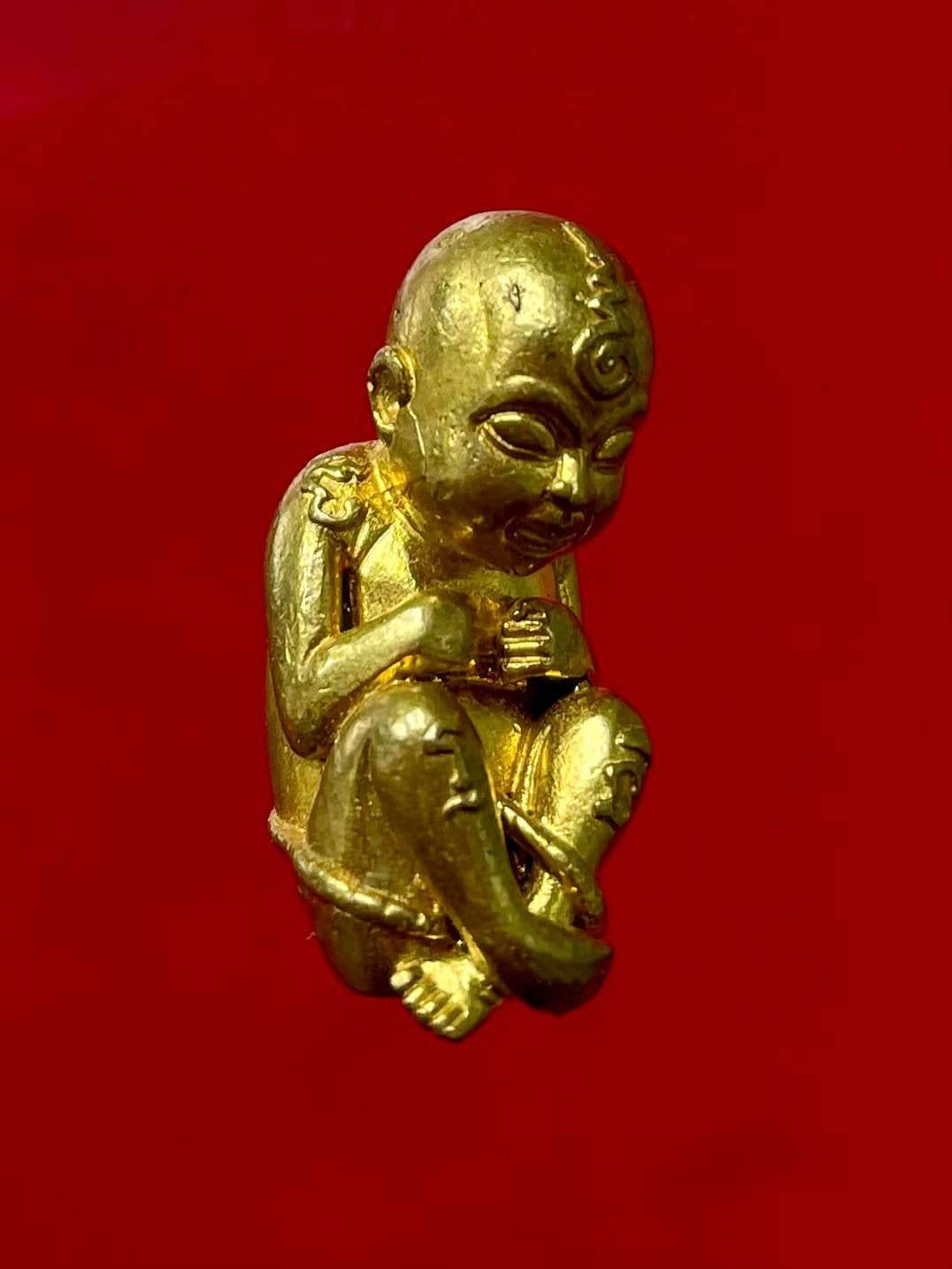 Gold Thai child spirit for good luck statue, symbolizing fortune and positive energy in the home