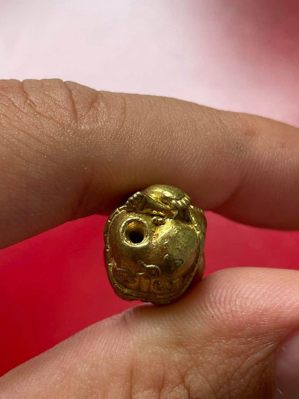 Thai child spirit for good luck charm held in hand, intricately designed for home blessings