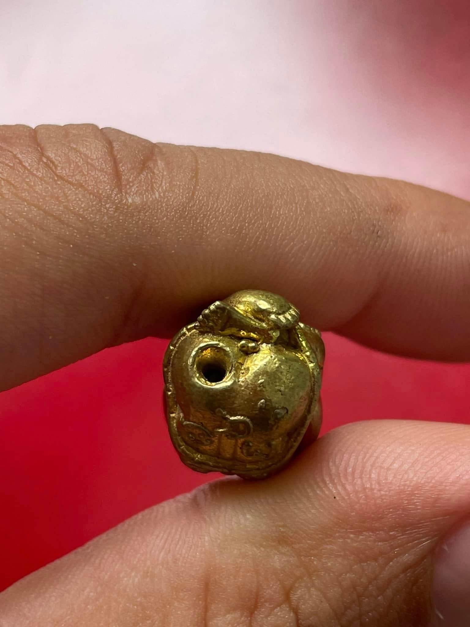 Thai child spirit for good luck charm held in hand, intricately designed for home blessings