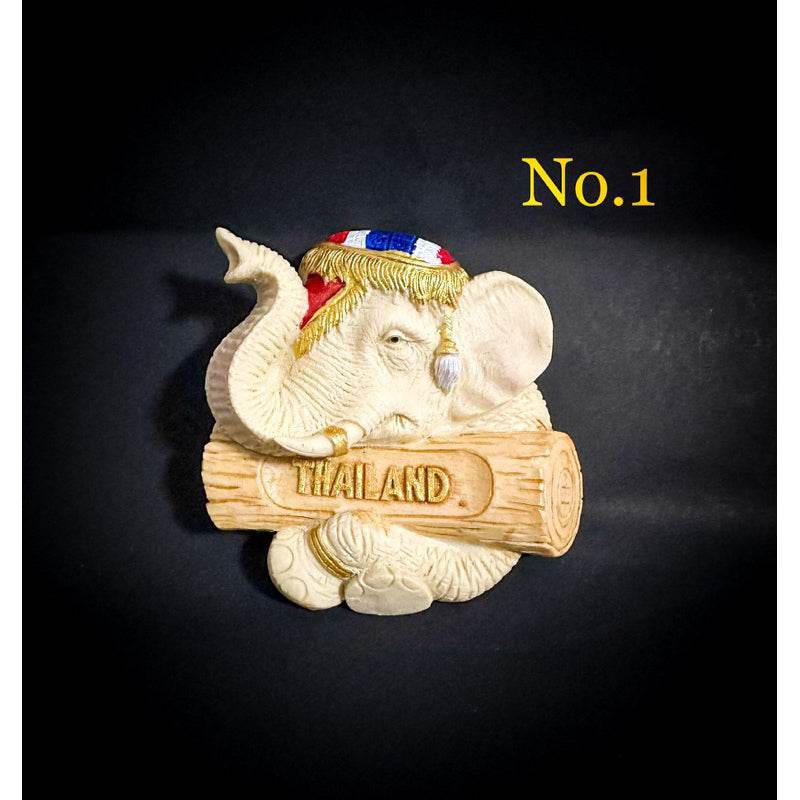 Thai elephant fridge magnet holding a log with Thailand text in traditional hat