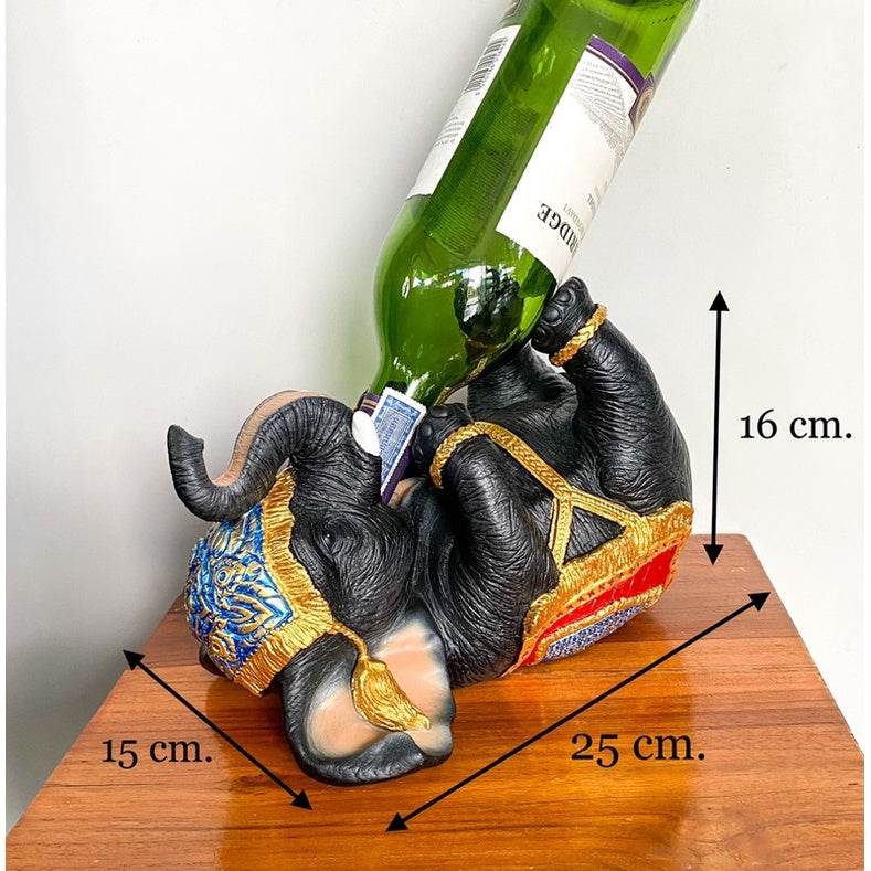 Thai elephant wine rack holding a green wine bottle with detailed traditional decorations