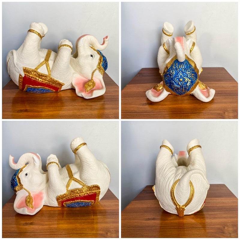 Thai elephant wine rack with intricate gold and blue detailing displayed on wooden surface from multiple angles