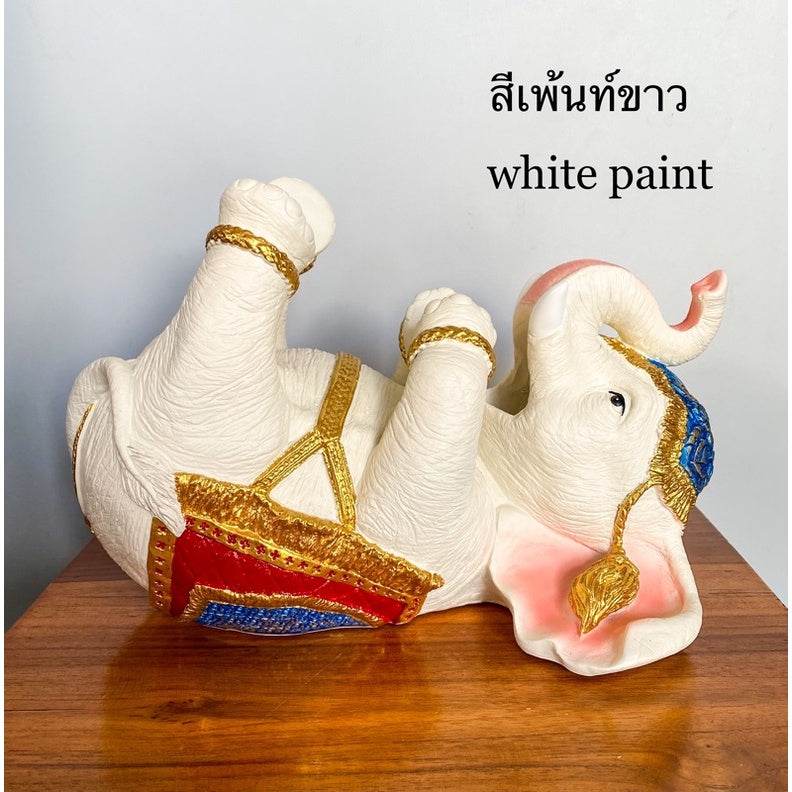 White paint Thai elephant wine rack with gold red and blue detailing on wooden table