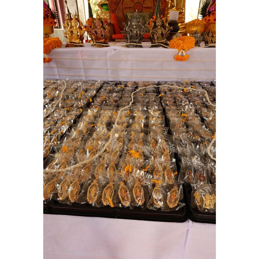 Assorted Thai Ganesh amulet spiritual protection displayed on a table for devotees and collectors
