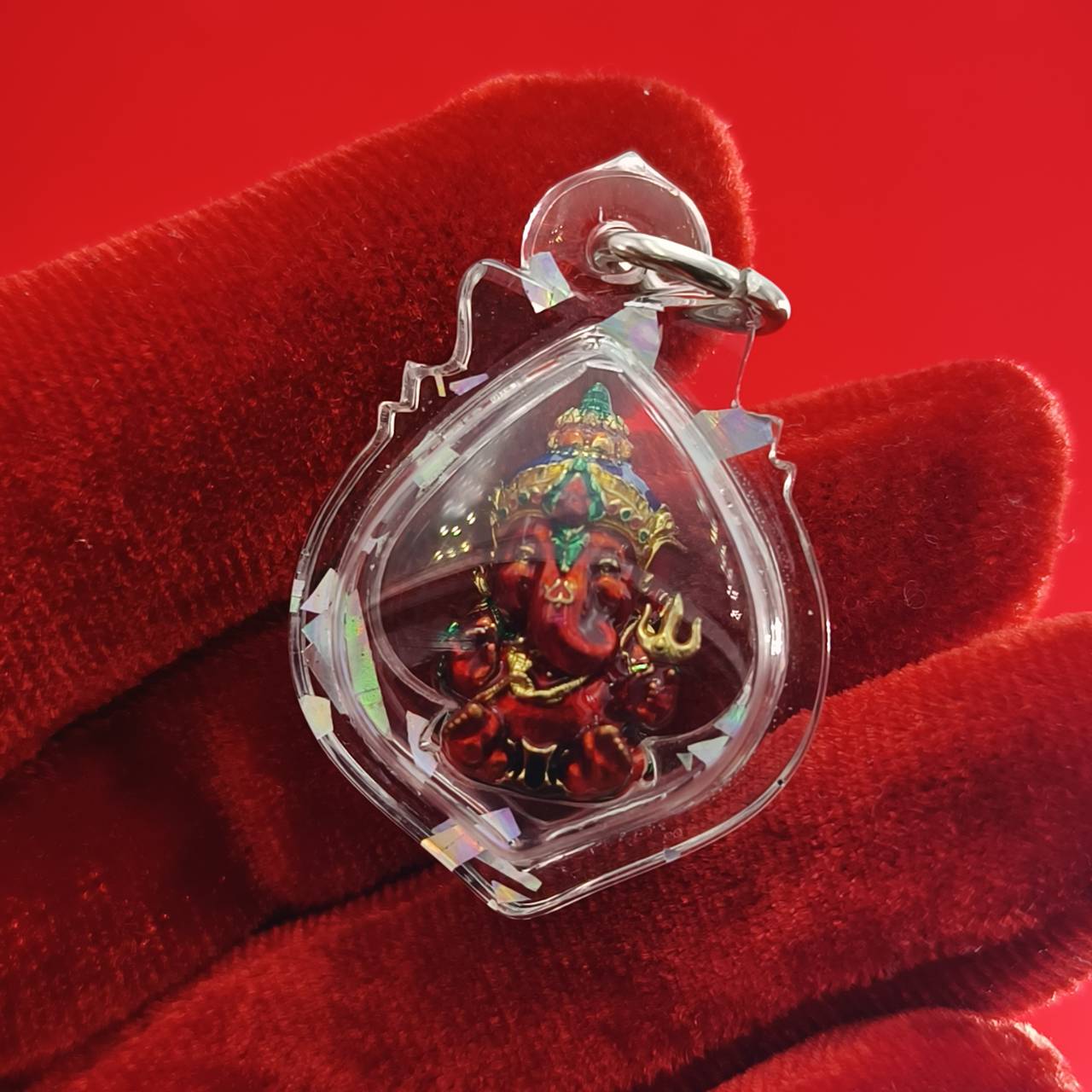 Thai Ganesha lucky charm pendant in a decorative clear casing for spiritual blessings