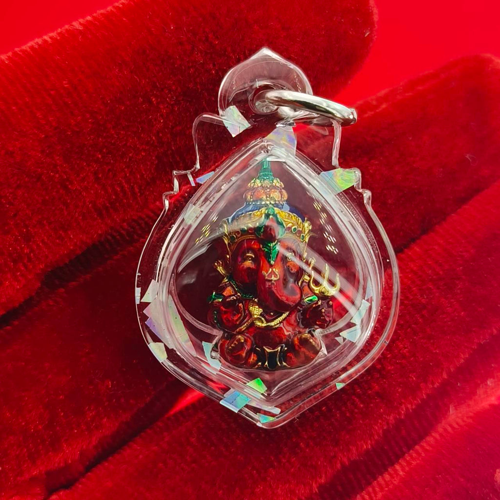 Thai Ganesha lucky charm pendant in a decorative clear casing for positive energy and blessings
