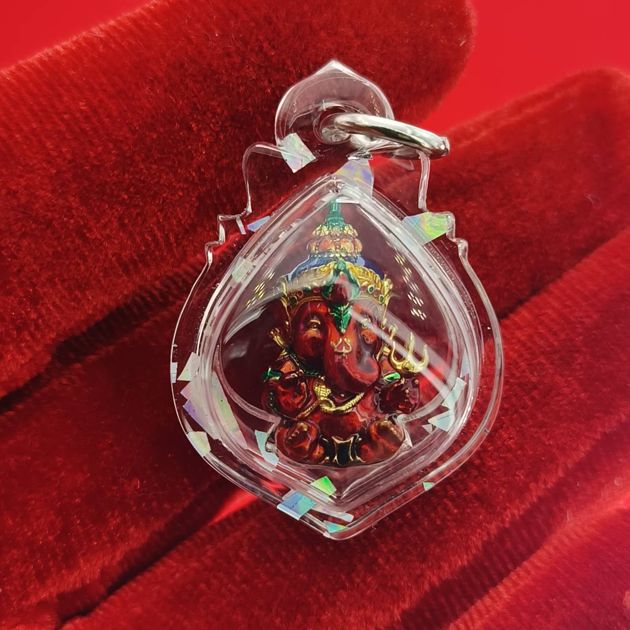 Thai Ganesha lucky charm pendant in a decorative clear casing for positive energy and blessings