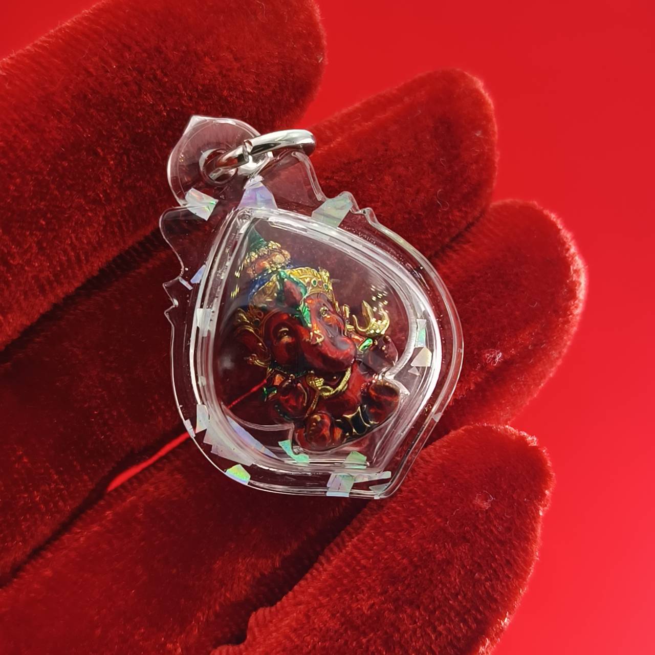 Thai Ganesha lucky charm pendant in a protective case, ideal for attracting good fortune