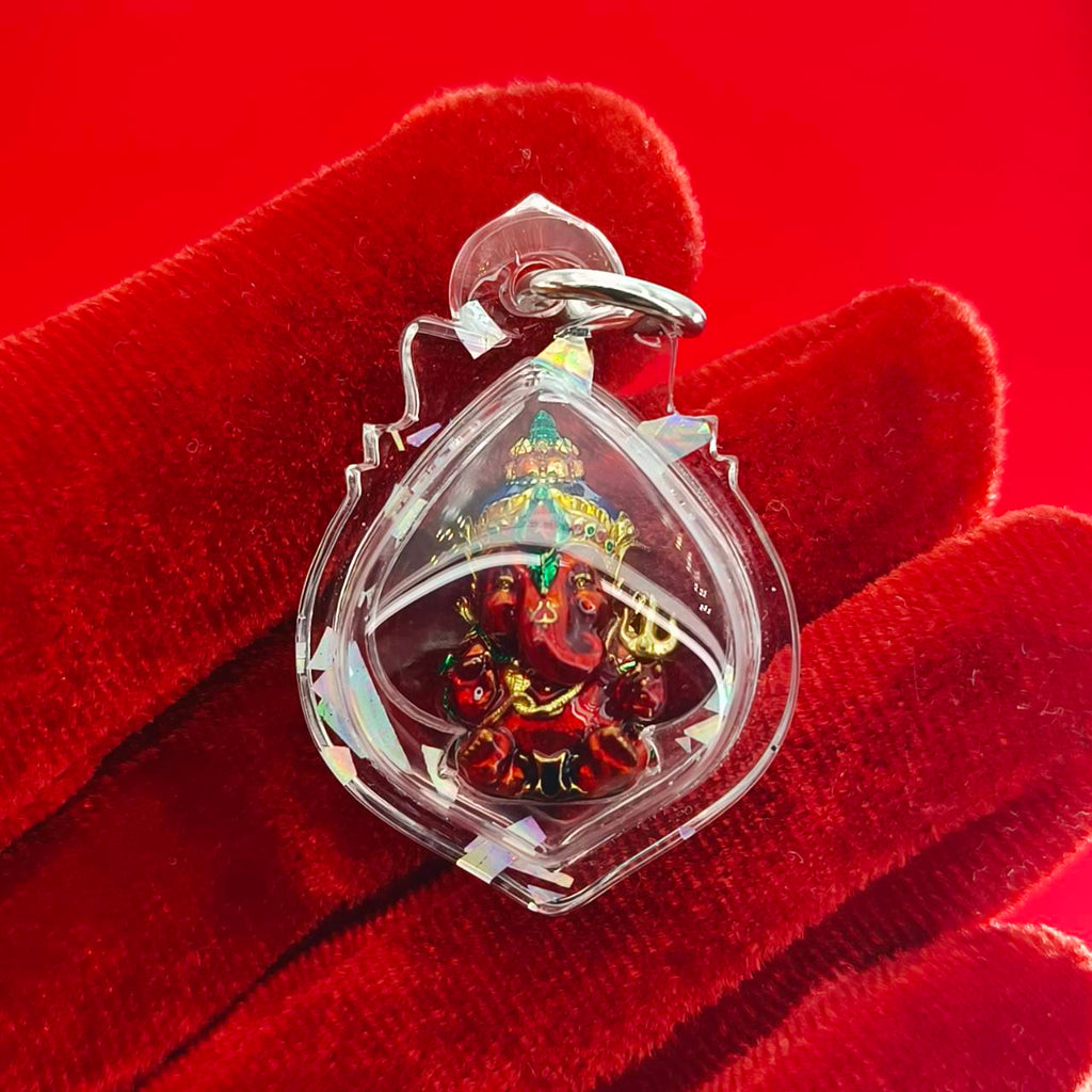 Thai Ganesha lucky charm pendant in clear case, featuring vibrant colors for home decor and spiritual beliefs