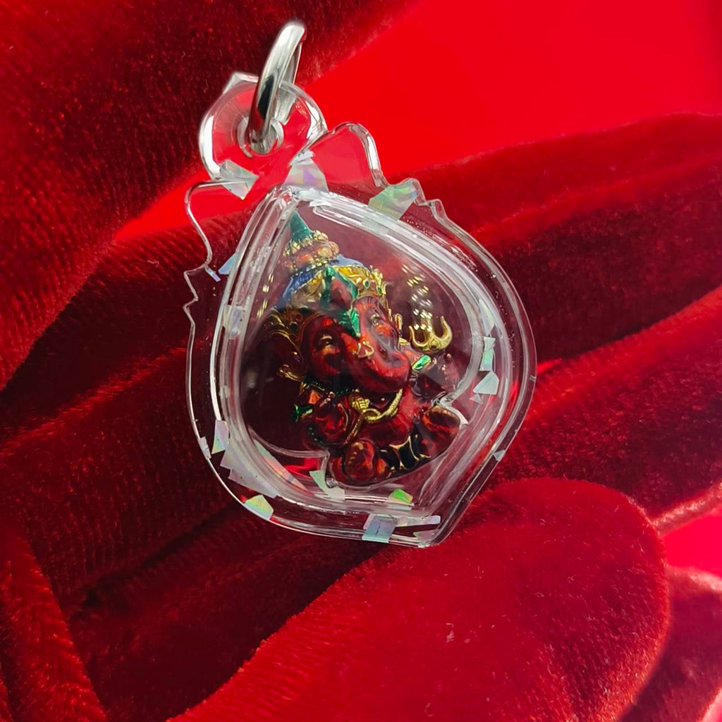 Thai Ganesha lucky charm pendant encased in clear resin for spiritual decoration and good fortune