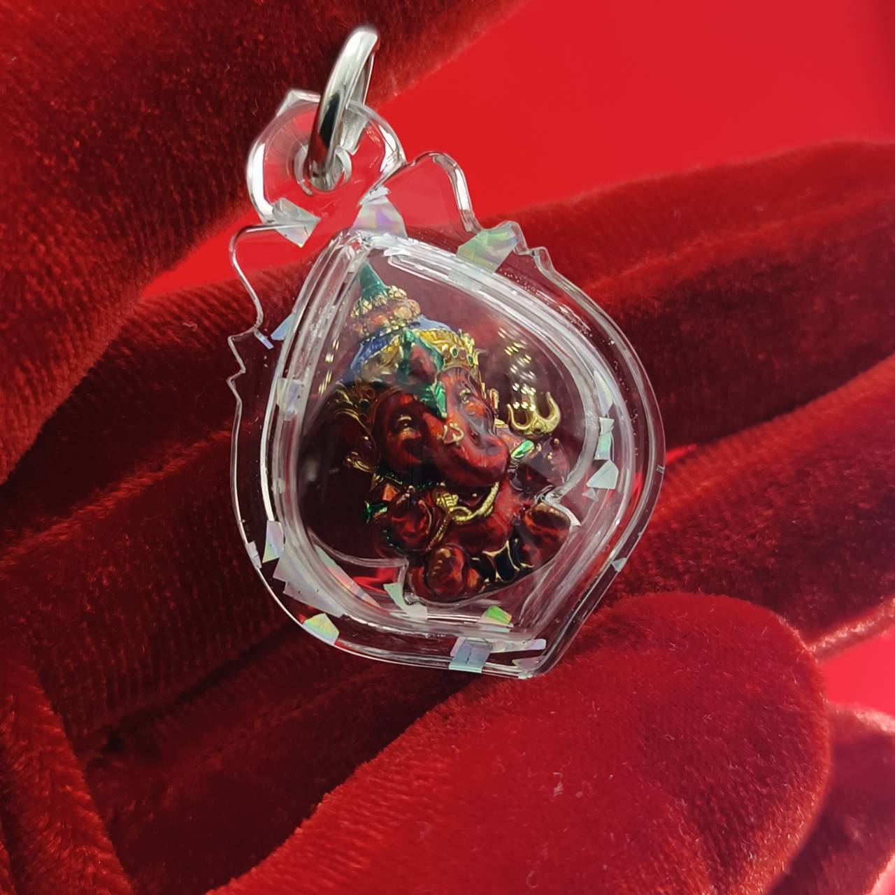 Thai Ganesha lucky charm pendant encased in clear resin for spiritual decoration and good fortune