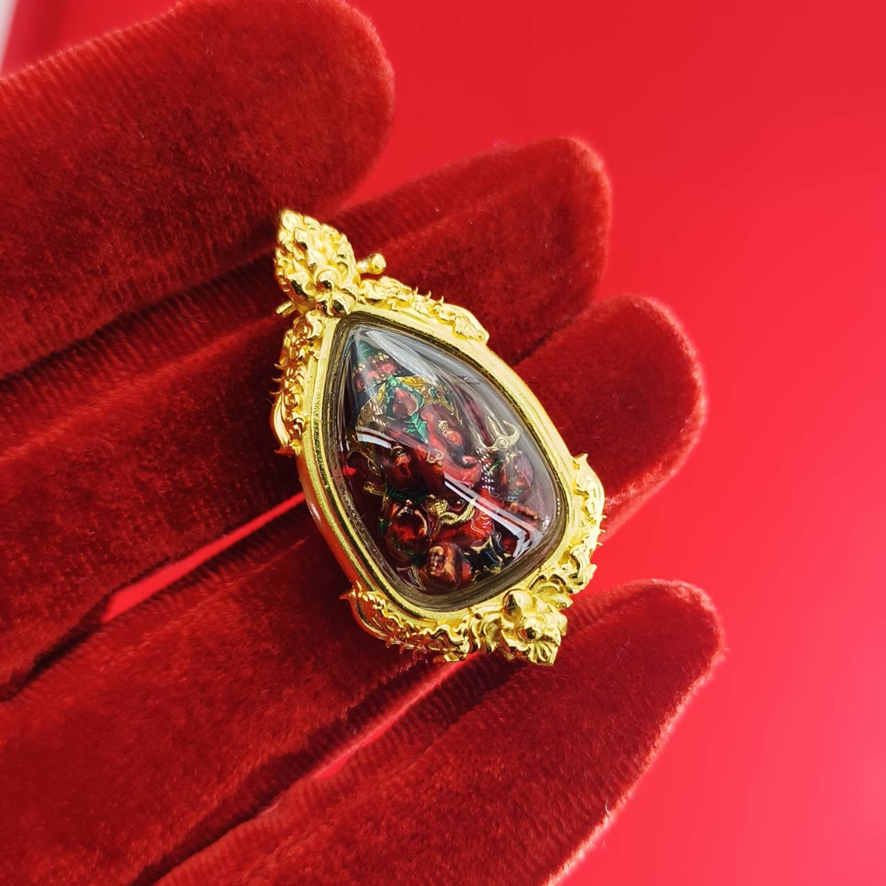 Thai Ganesha pendant for success featuring intricate detailing and a vibrant design on a luxurious backing