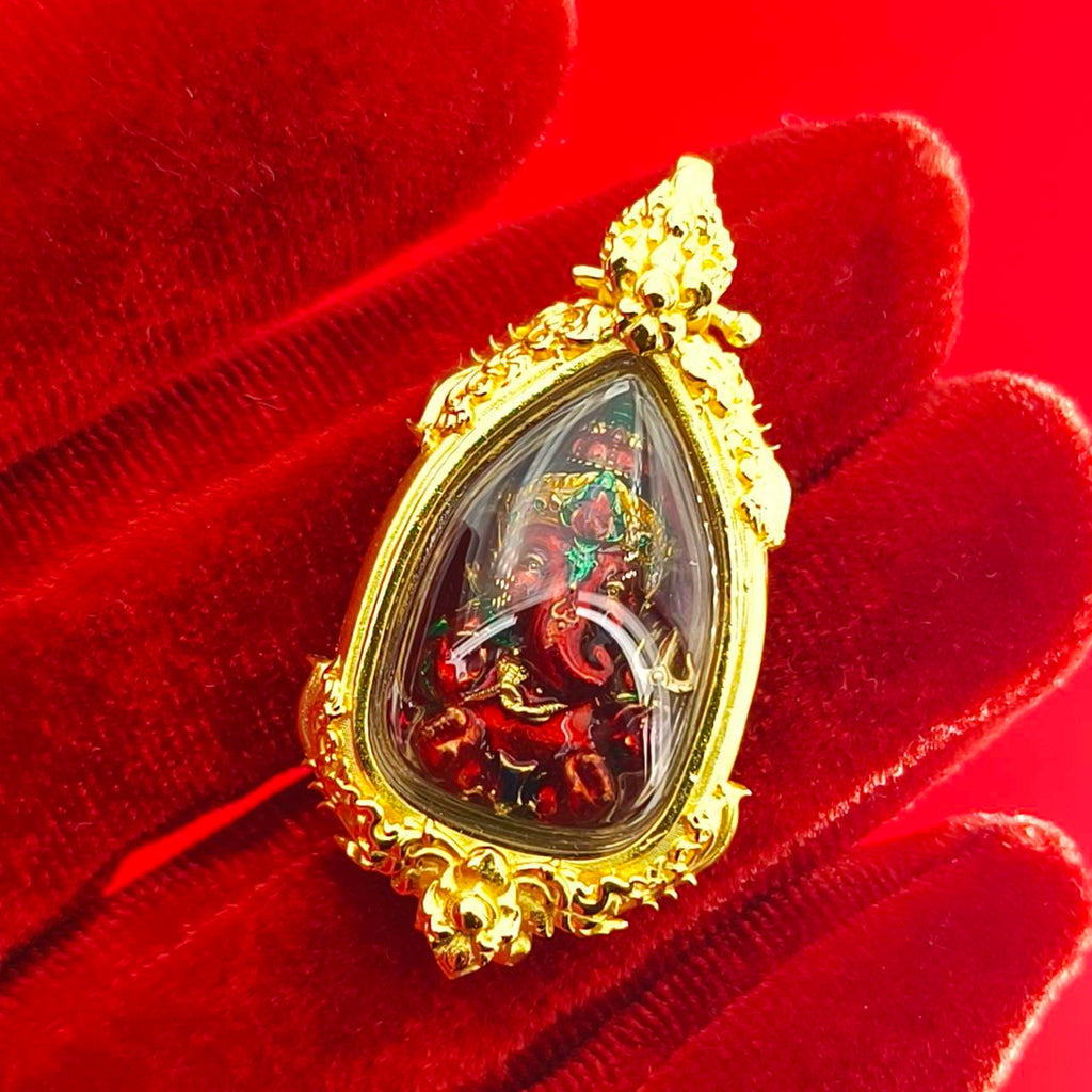 Thai Ganesha pendant for success with intricate gold details and vibrant colors in a decorative frame