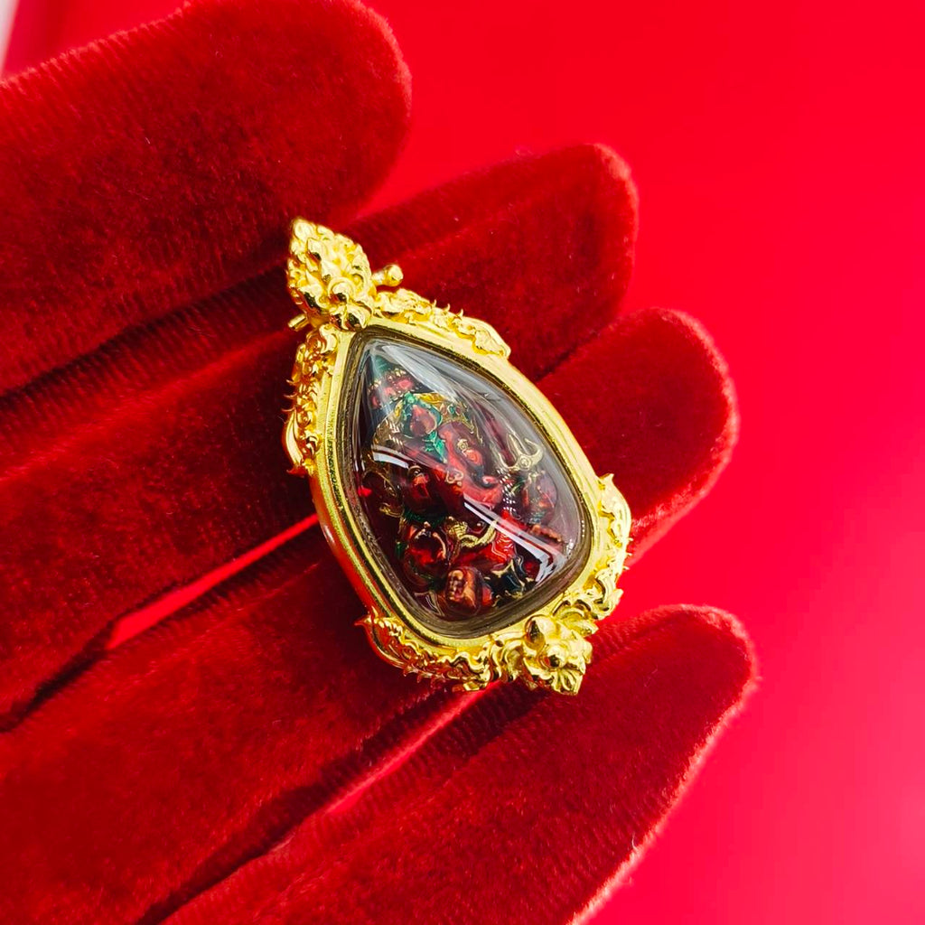 Thai Ganesha pendant for success in gold setting, featuring intricate details and vibrant colors