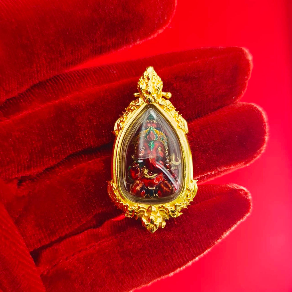 Intricate Thai Ganesha pendant for success in gold frame, symbolizing prosperity and blessings