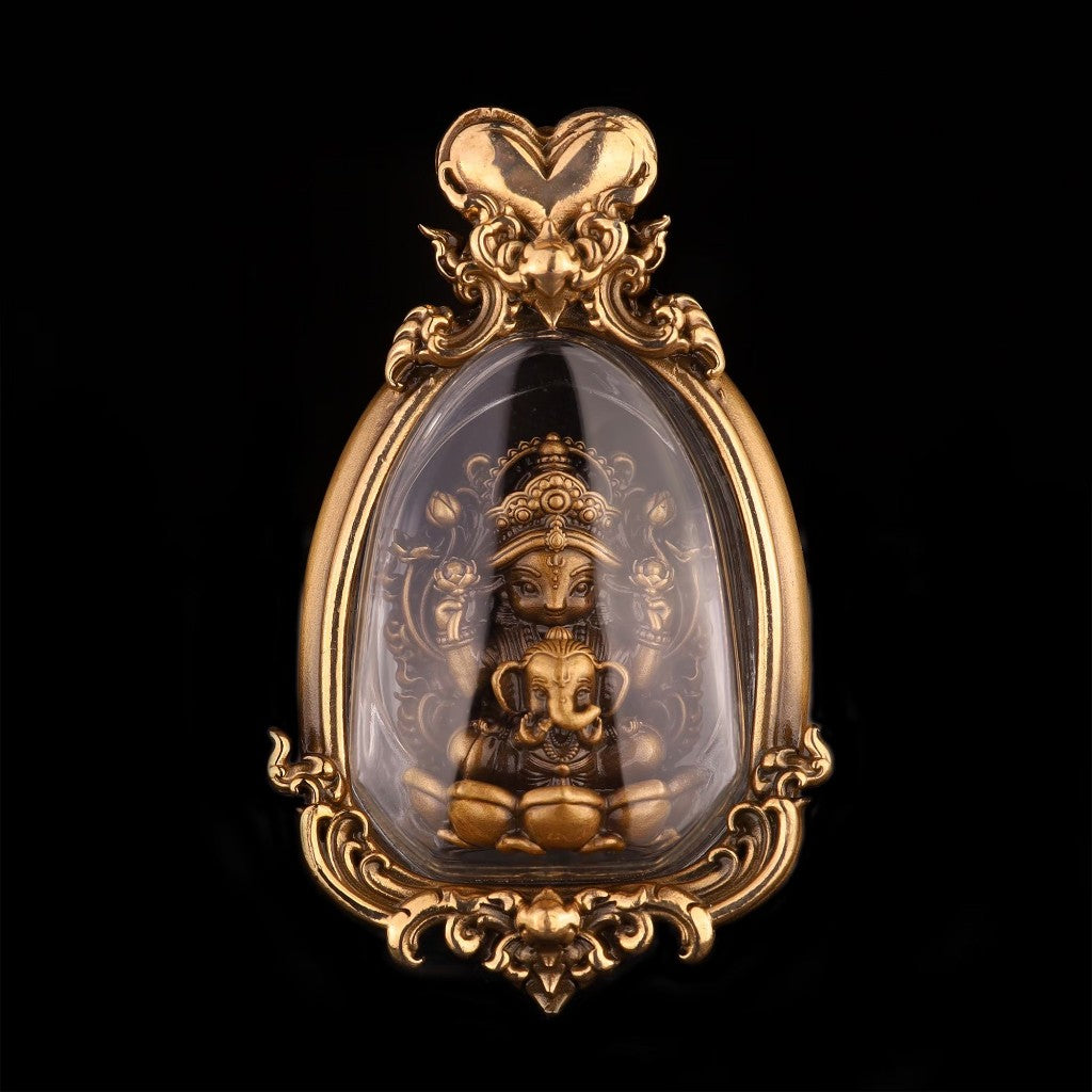 Thai goddess amulet for prosperity in a decorative gold frame with intricate details