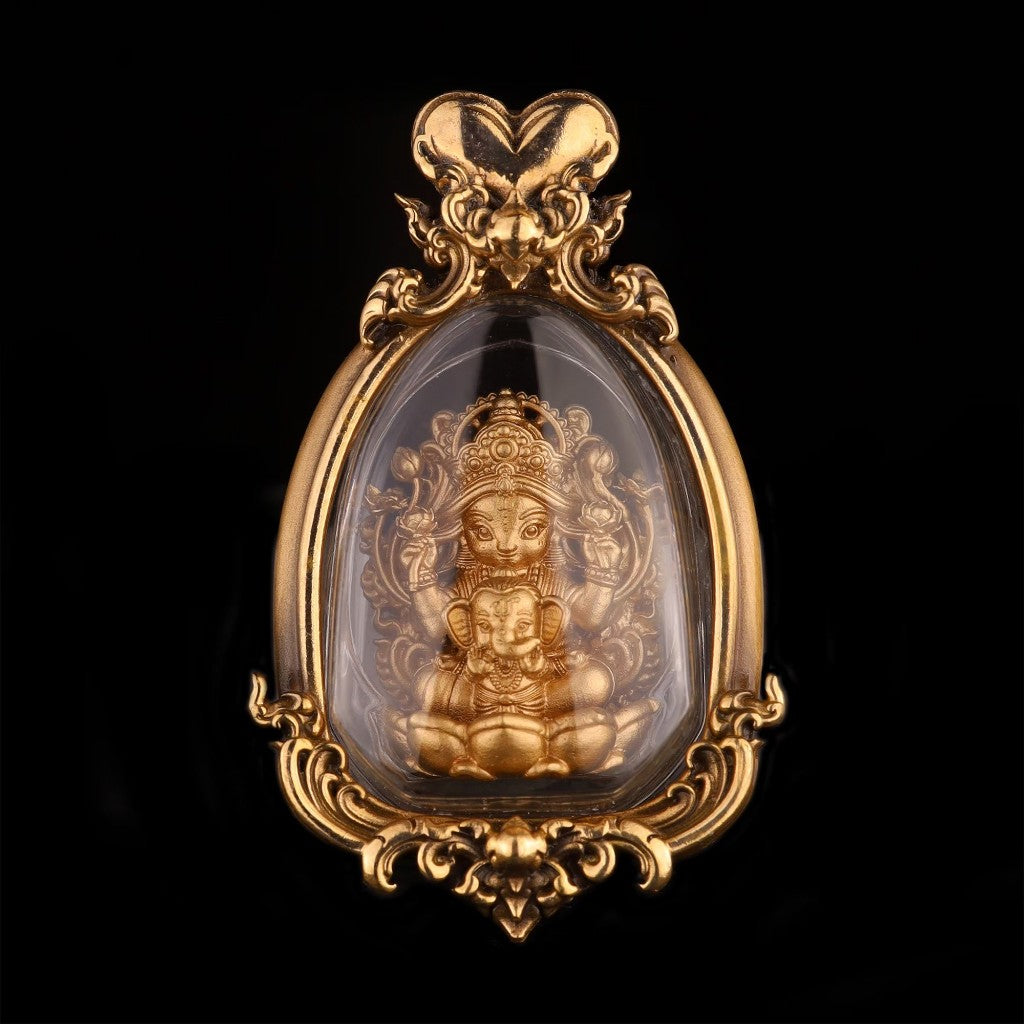 Thai goddess amulet for prosperity encased in a gold frame with intricate detailing