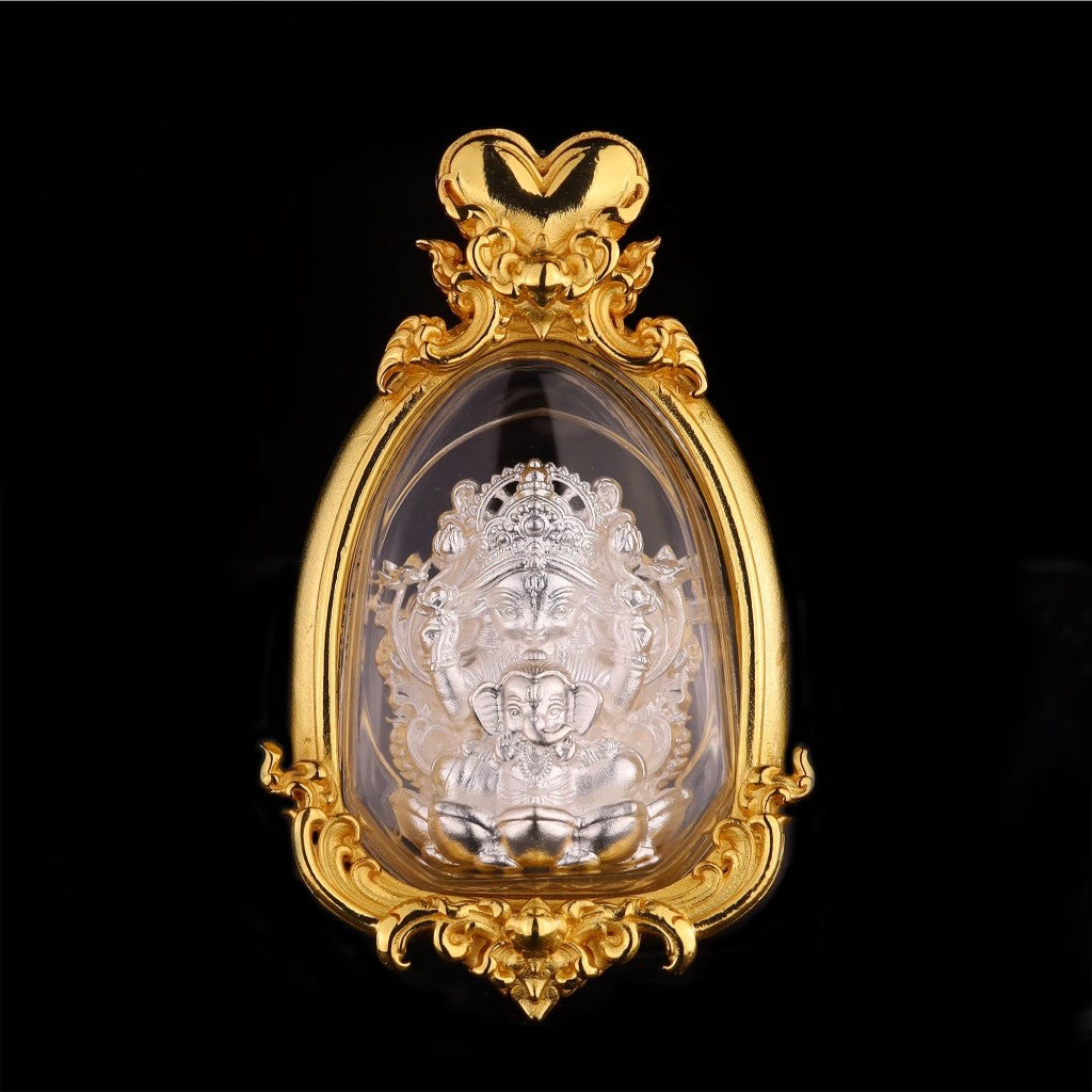 Thai goddess amulet for prosperity encased in an ornate gold frame with detailed craftsmanship