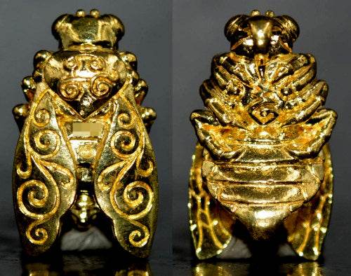 Thai golden bee amulet for wealth with intricate gold detailing and traditional design