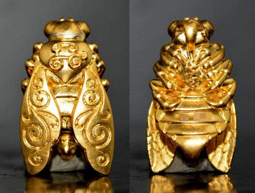 Thai golden bee amulet for wealth detailed gold figurine with intricate engraved patterns from Thai Blessing Co