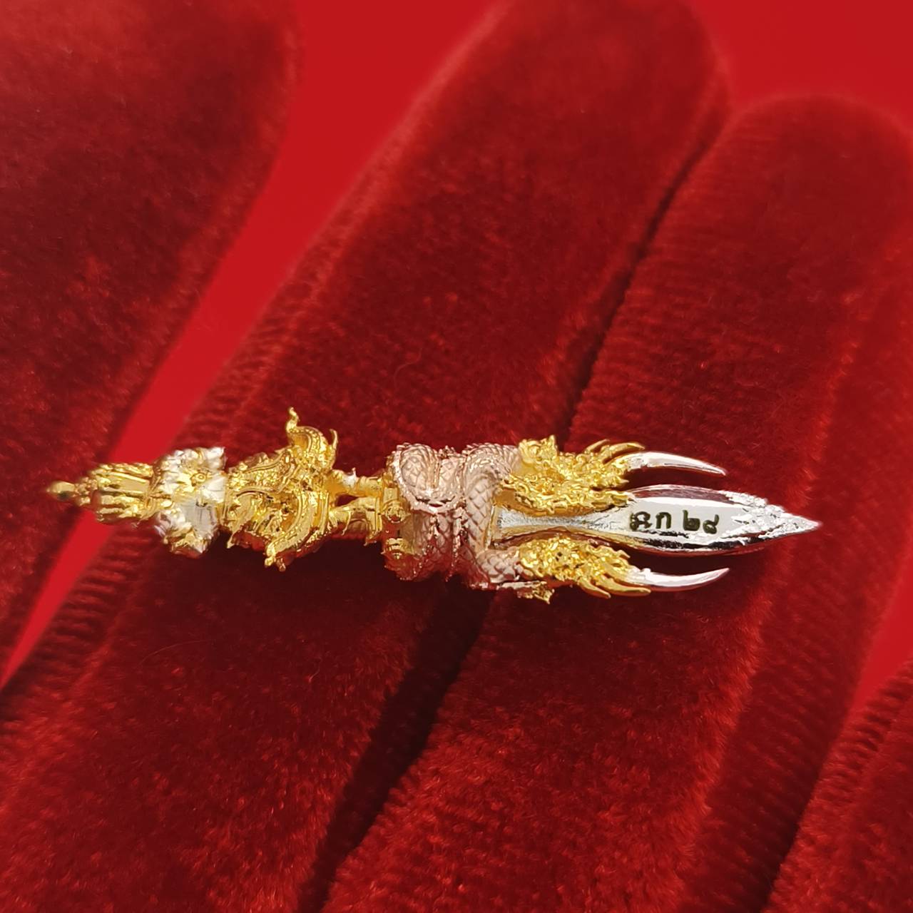 Thai guardian amulet Klang Setthi edition with intricate gold detailing, symbolizing protection and good fortune