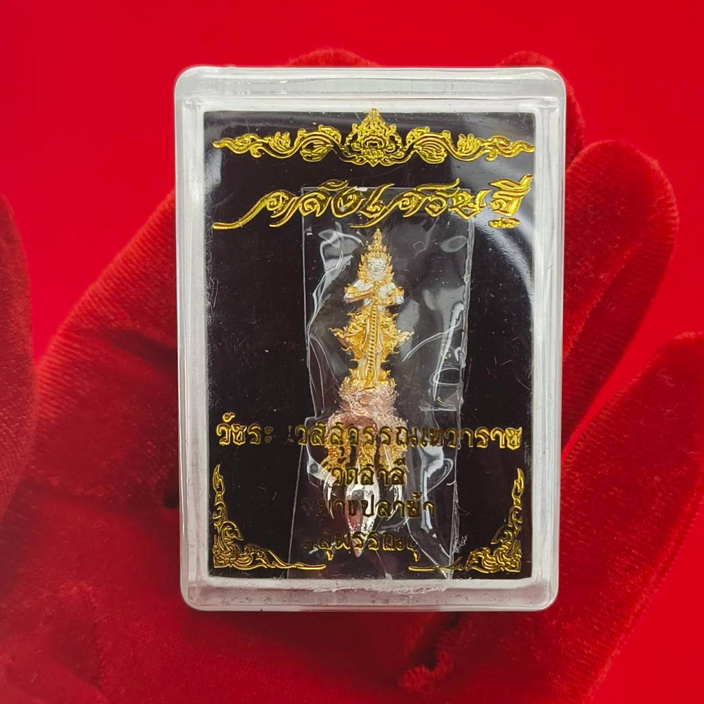 Thai guardian amulet Klang Setthi edition displayed in a protective case on a red background
