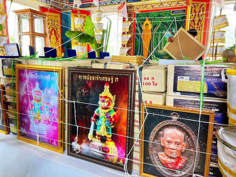 Thai guardian prosperity collectible showcased among decorative items in a vibrant shop setting