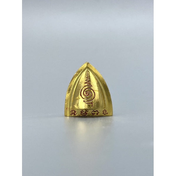 Gold Thai luck amulet for victory with intricate engraved designs by Thai Blessing Co