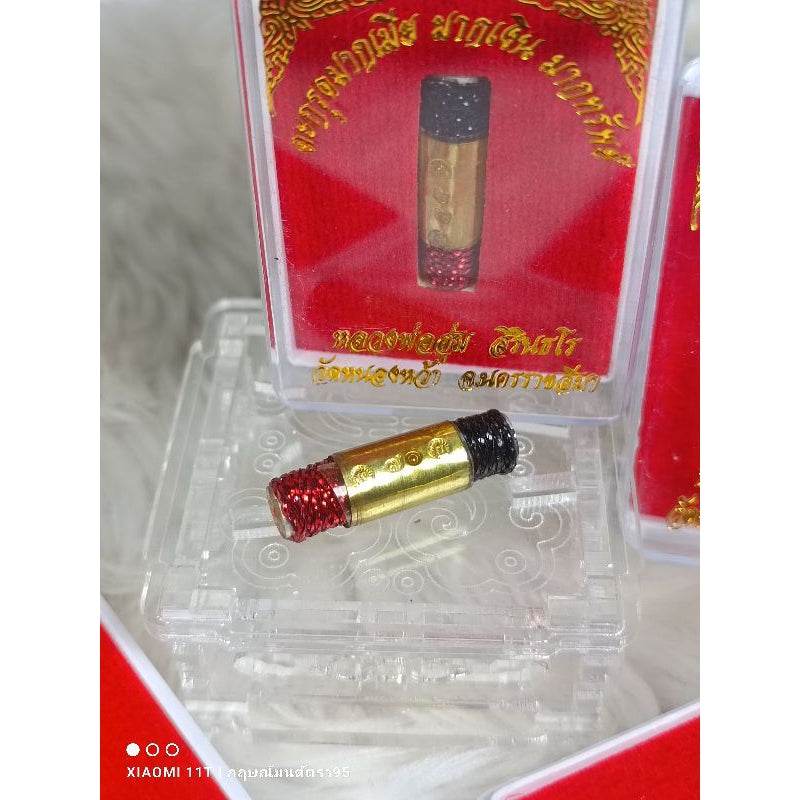 Thai lucky charm many wives small gold and black amulet with red details in clear display box