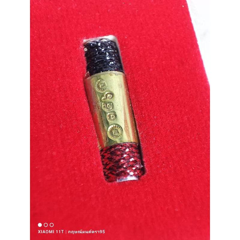 Thai lucky charm many wives by Thai Blessing Co with gold and red-black braided design on red background