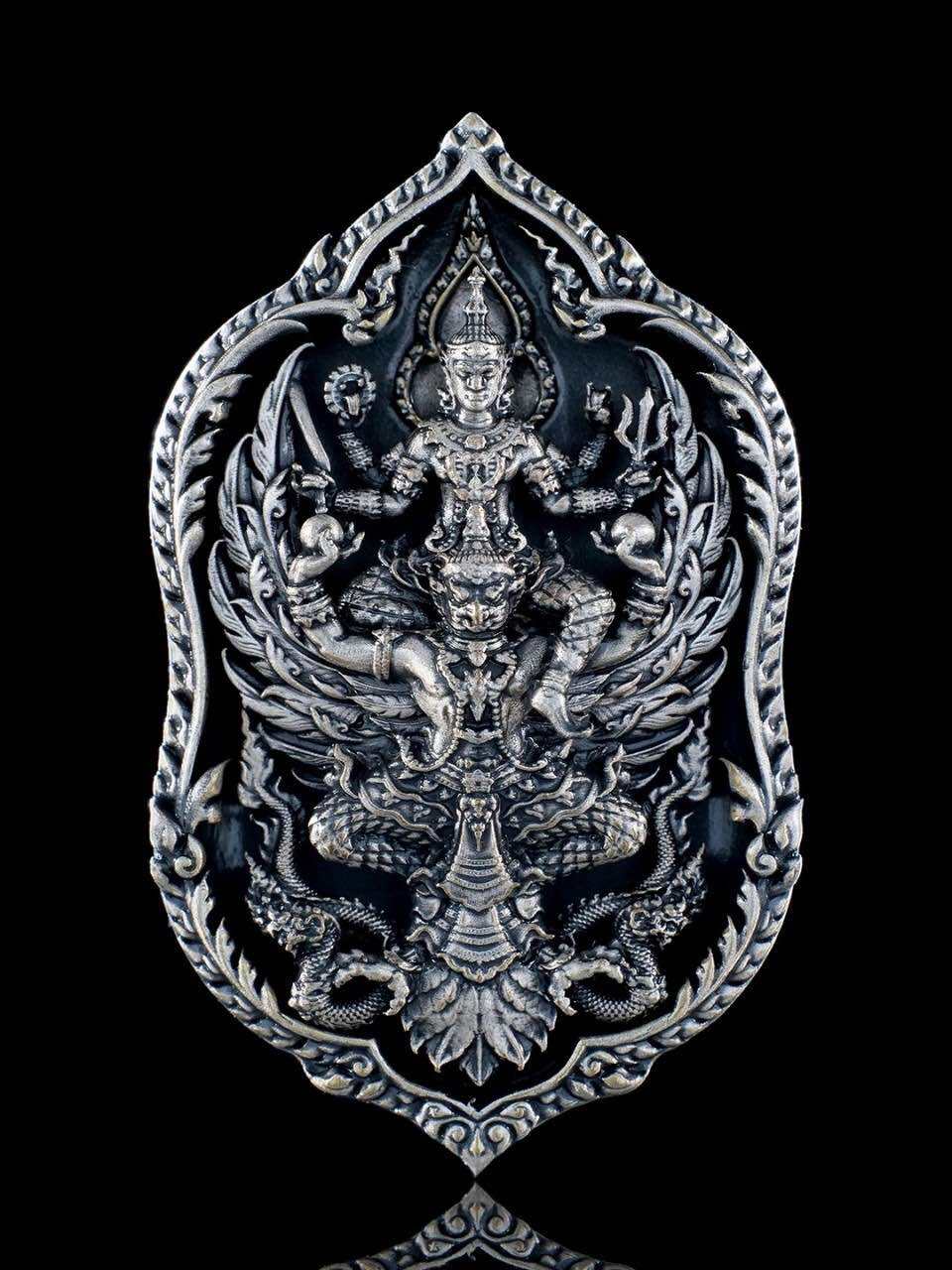 Thai lucky coin for wealth and protection featuring intricate design and spiritual imagery
